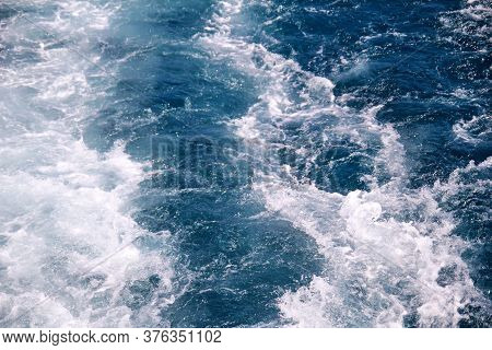 Turbulence Made By Foam Of Sea Water From A High-speed Yacht On Surface Of Sea. Blue Sea Waves With 