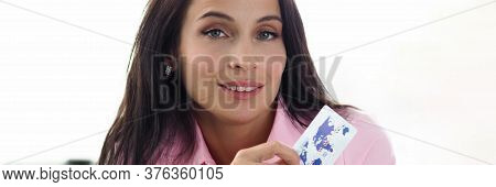 Portrait Of Attractive Young Woman Holding White Plastic Credit Card. Pretty Female In Pink Blouse P
