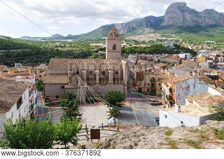 Church And Main Square Of Polop De Marina With Rocky Mountainrange, Costa Blanca, Spain