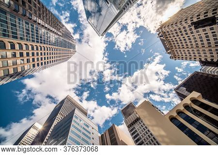 Business And Finance Concept, Looking Up At Modern Office Building Architecture In The Financial Dis
