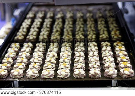 Biscuit Production Line With Twin Color Jam Drops Cookies On The Trays. Selective Focus.