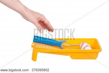 Hand With Striped Wool Paint Roller, Home Decoation And Improvement. Isolated On White Background.