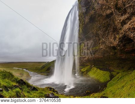 Seljalandsfoss, Waterfall In The South Region In Iceland, Part Of The Seljalands River That Has Its 