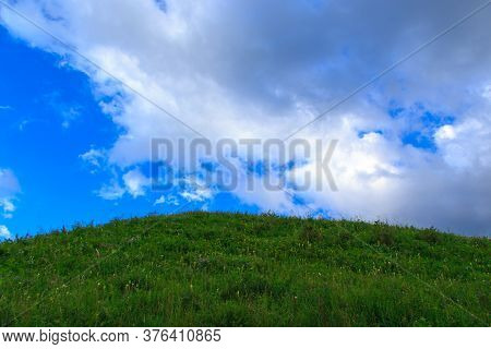 Beautiful Spring And Summer Landscape. Lush Green Hills. Spring Blooming Herbs.