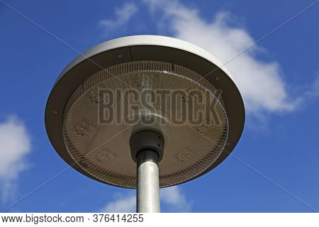 A New Street Lamp With Led Light Against A Blue Summer Sky