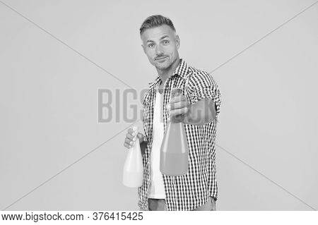 Make Your House Clean. Handsome Guy Hold Spray Bottles. Disinfectant Cleaners And Sprays. Clean Habi
