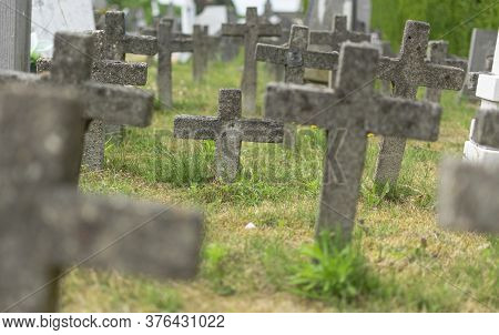 Sint Gillis Waas, 09 Juli 2019, Concrete Weathered Crosses In An Old Graveyard