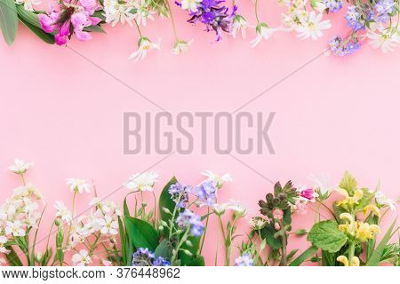 Happy Mother's Day Concept. Wildflowers Colorful Frame On Pink Paper Background, Flat Lay With Space