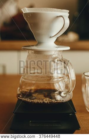 Drip Coffee. Brewing Aromatic Fresh Coffee In Paper Filter  In Pour Over On Scale. Alternative Coffe