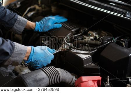 Checking The Engine, Mechanic Fixing The Engine, Copy-space.