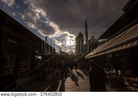 Sarajevo, Bosnia And Herzegovina - April 17, 2017: Street With Tourists And A Mosque Minaret In The 