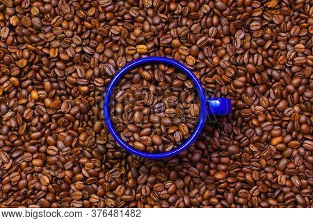 Blue Tin Mug Full Of Coffee Beans. Fair Trade. Commodity Trade. Fresh Coffee Beans.
