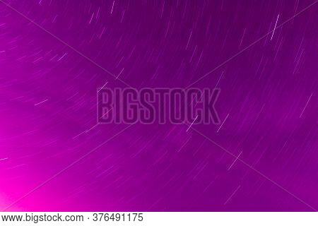 Background Of Round Or Circular Star Track Or Trajectory On The Red, Pink Or Rose Clear Night Sky. S