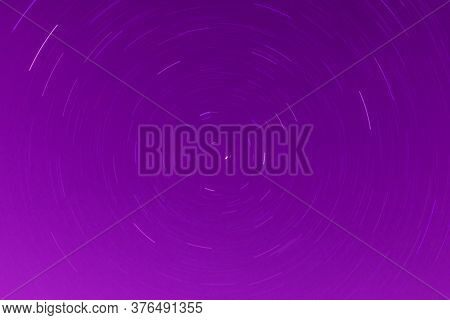 Background Of Round Or Circular Star Track Or Trajectory On The Red, Pink Or Rose Clear Night Sky. S