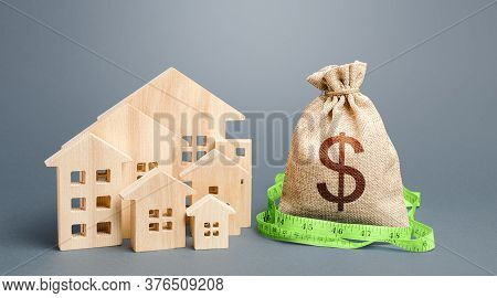 Residential Houses And A Dollar Money Bag. Property Real Estate Valuation. Buying And Selling, Fair 