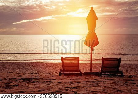 Red Umbrella On The Beach In Sunrie