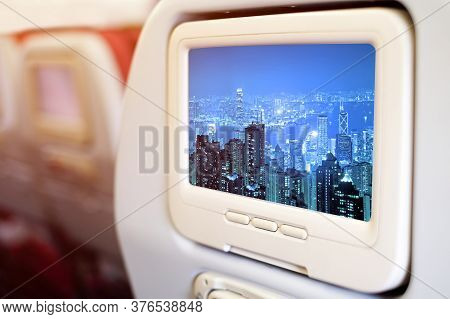 Aircraft Monitor In Front Of Passenger Seat Showing Panorama Vire Hongkong Cityscape At Night , Hong