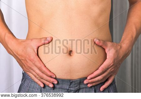 Skinny Man With Belly Fat Pulled Have Pulled Their Abdominal Muscle