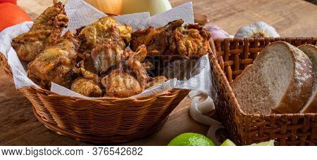 Brazilian Style Deep Fried Chicken And Sliced White Bread. Called Frango A Passarinho
