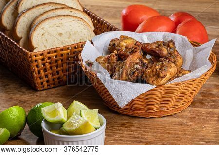 Brazilian Style Deep Fried Chicken And Sliced White Bread. Called Frango A Passarinho