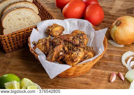 Brazilian Style Deep Fried Chicken And Sliced White Bread. Called Frango A Passarinho