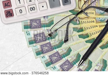 1000 Sri Lankan Rupees Bills Fan And Calculator With Glasses And Pen. Business Loan Or Tax Payment S