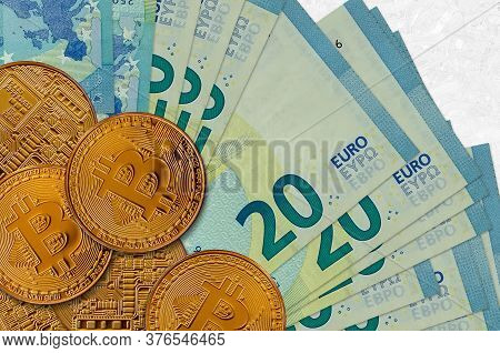 20 Euro Bills And Golden Bitcoins. Cryptocurrency Investment Concept. Crypto Mining Or Trading