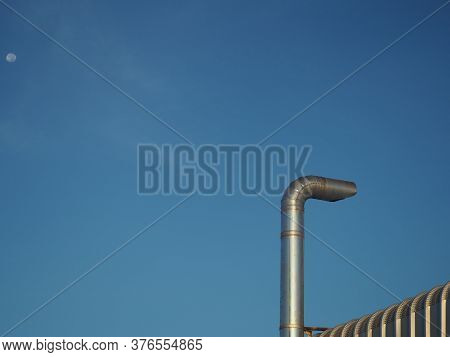 Stainless Steel Chimney On A Blue Sky Background.
Concept Of Environmental Protection.