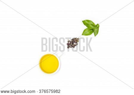 One Cup Of Oolong Tea With Fresh Leaves And A Heap Of Dry Green Tea On A White Background, With Copy