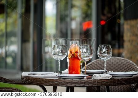 Served Table With Plates Wine Glasses Cool Fruit Lemonade Outside Summet Terrace, Horizontal
