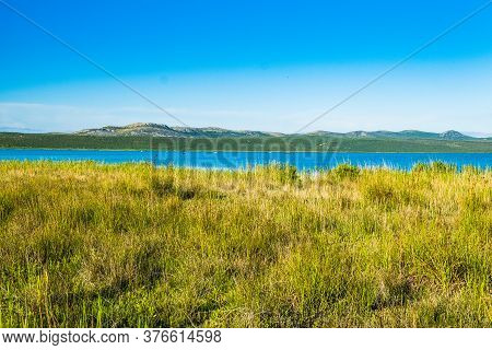 Beautiful Meadow And Green Lake In Ornithological Nature Park Vrana (vransko Jezero) In Dalmatia, Cr