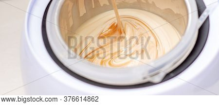 Electric Wax Warmer Or Wax Heater With Melted Wax During Heating Inside Bowl