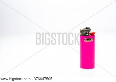 Miercurea Ciuc, Romania- 16 July 2020: Small Pink  Bic Cigarette Lighter On White Background.