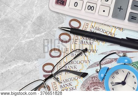 10 Polish Zloty Bills And Calculator With Glasses And Pen. Business Loan Or Tax Payment Season Conce
