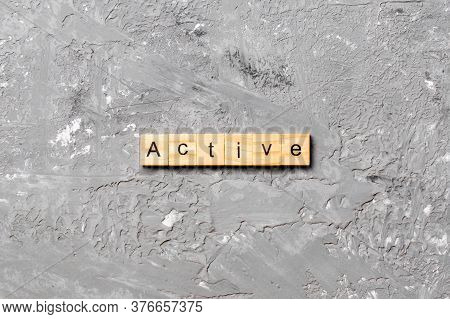Active Word Written On Wood Block. Active Text On Table, Concept