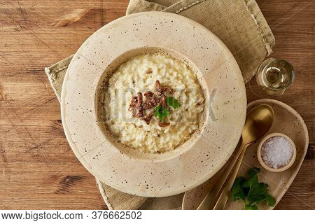 Risoto With Chanterelle Mushrooms In Large Plate. Top View, Copy Space