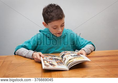 A Nine Year Old Boy Reading Percy Jackson And The Sea Of Monsters, Taken On The 27th February 2020 I