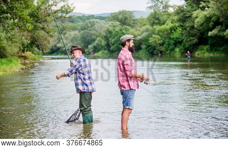 Get Hobby. Hobby And Sport Activity. Trout Bait. Male Friendship. Family Bonding. Two Happy Fisherma