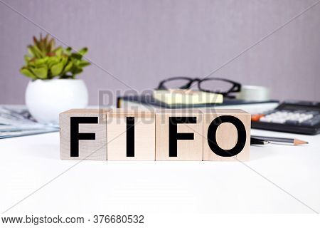 Fifo Word On Wooden Cubes, Cubes On A White Background, Business And Finance Concept