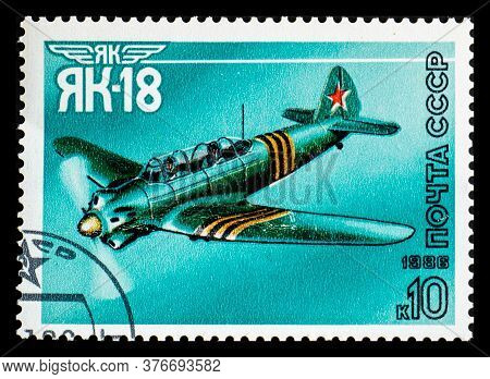 Russia, Ussr - Circa 1986: A Postage Stamp From Ussr Showing Aircraft Yakovlev Yak-18 Or Nanchang Cj