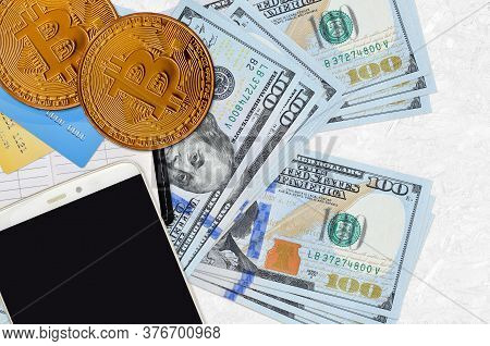 100 Us Dollars Bills And Golden Bitcoins With Smartphone And Credit Cards. Cryptocurrency Investment