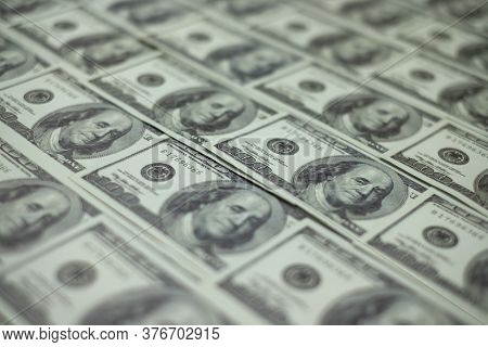 Group Of Money Stack Of 100 Us Dollars Banknotes A Lot Of Is Arranged In A Beautiful, Selective Focu