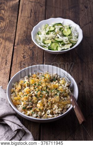 Traditional Middle Eastern Dish, Mujadara Of Lentils, Rice And Fried Onions With A Salad Of Cabbage 