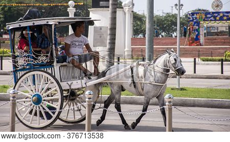 Manila, Philippines - December 27, 2016: Kalesa (horse Drawn Carriage) At Rizal Park