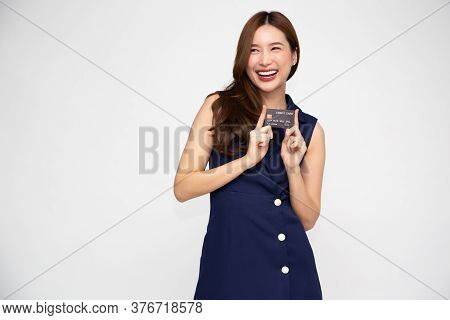 Young Beautiful Asian Woman Smiling Holding Credit Card Isolated On White Background