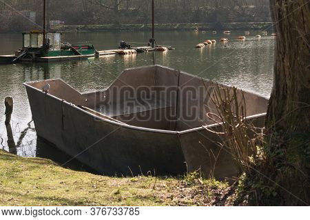 Dredger, Floating Excavator When Dredging Of Soil, Sand And Silt From A River.