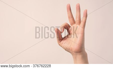 Male Moedl Is Doing A-ok  Hand Sign On White Background.