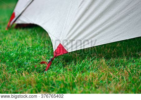 Edge Touristic Tent Tighten With Roops On The Green Grass