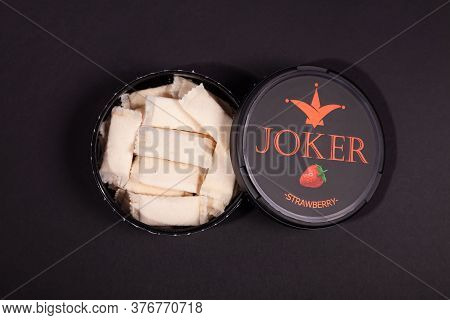Swedish Snus, An Open Can Of Snuff On A Black Background, Snus Is Addictive. Moscow Russia November 