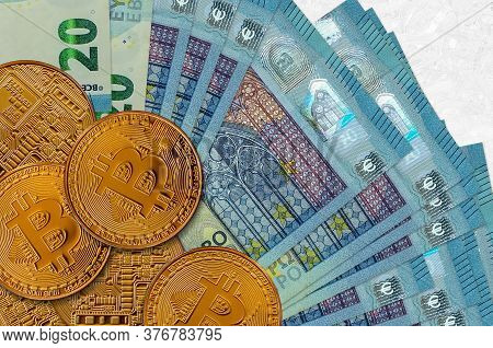 20 Euro Bills And Golden Bitcoins. Cryptocurrency Investment Concept. Crypto Mining Or Trading